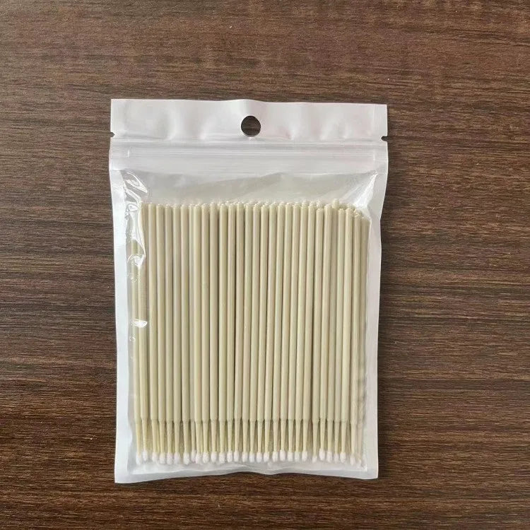 Disposable micro applicator brushes with colourful handles and bendable cotton swabs for makeup and eyelash extensions