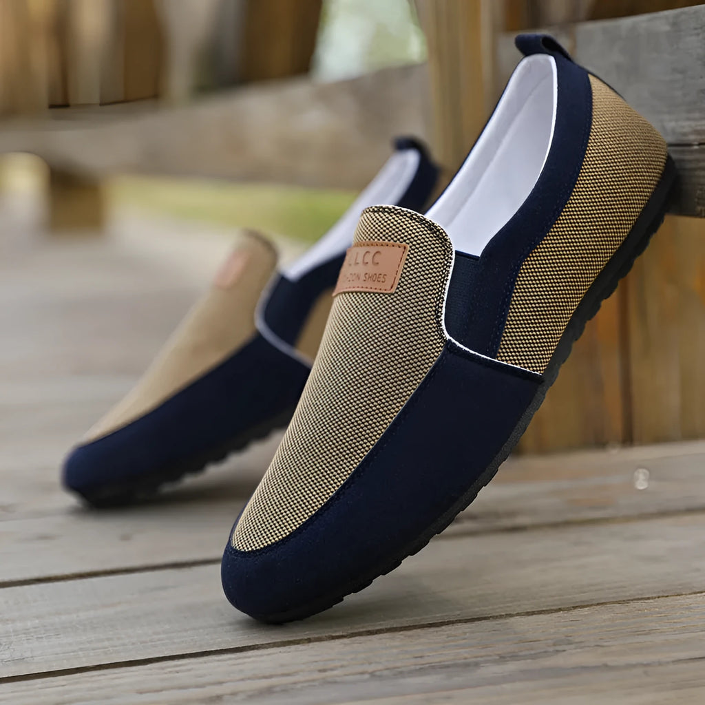 Men's grey and khaki canvas casual shoes with round toe and stitching detail.