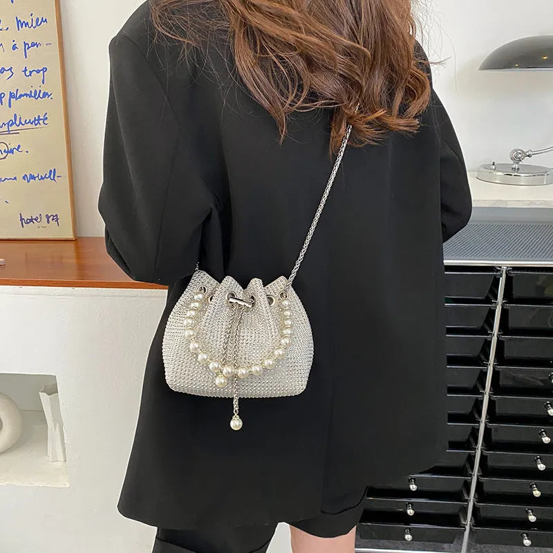 Soft PU leather crossbody bag with diamond embellishments and chain strap in bucket shape