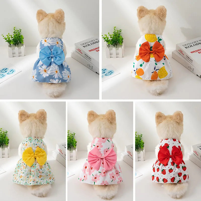 Ultra-thin light orange polyester pet dress for dogs or cats with a floral butterfly knot and bow.