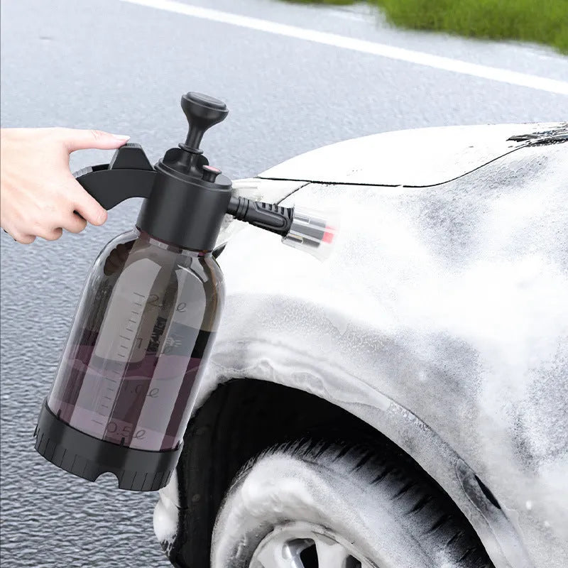 Black 2-litre hand-held foam watering can sprayer with pump handle and two nozzles