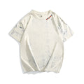 Grey loose fit short sleeve t-shirt with a full body tie dye pattern, showing round neck collar.