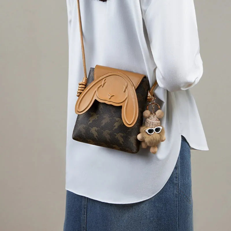 coffee colour crossbody phone bag with pom-pom pendant PU material vertical square shape open pockets