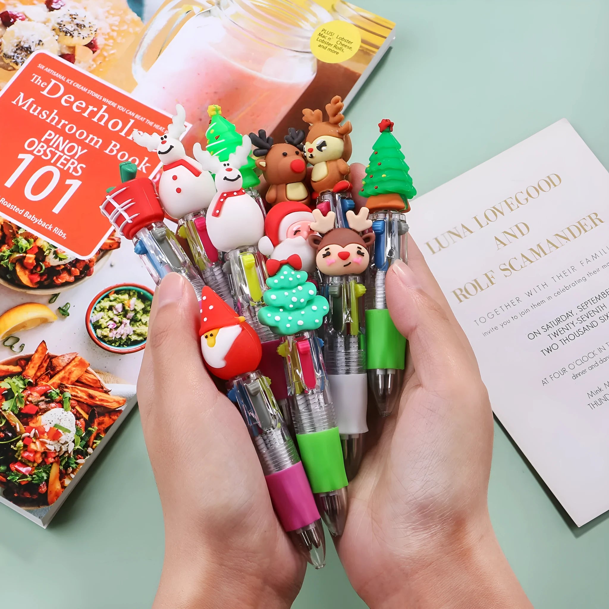Christmas mini four-colour press-action ballpoint pen with festive designs measuring 11 cm.