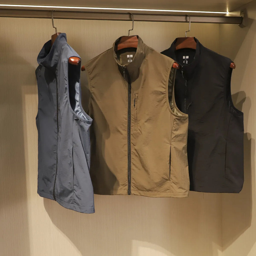 Men's thin nylon vest in army green with side seam pockets and a straight retro cardigan cut.