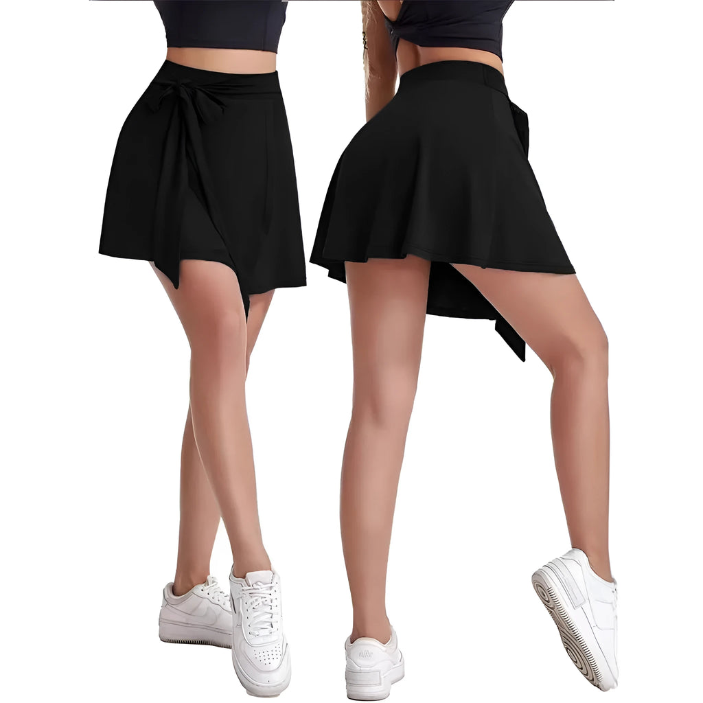 Black thigh-length sports skirt with attached shorts, showing high waist and shoulder strap details.