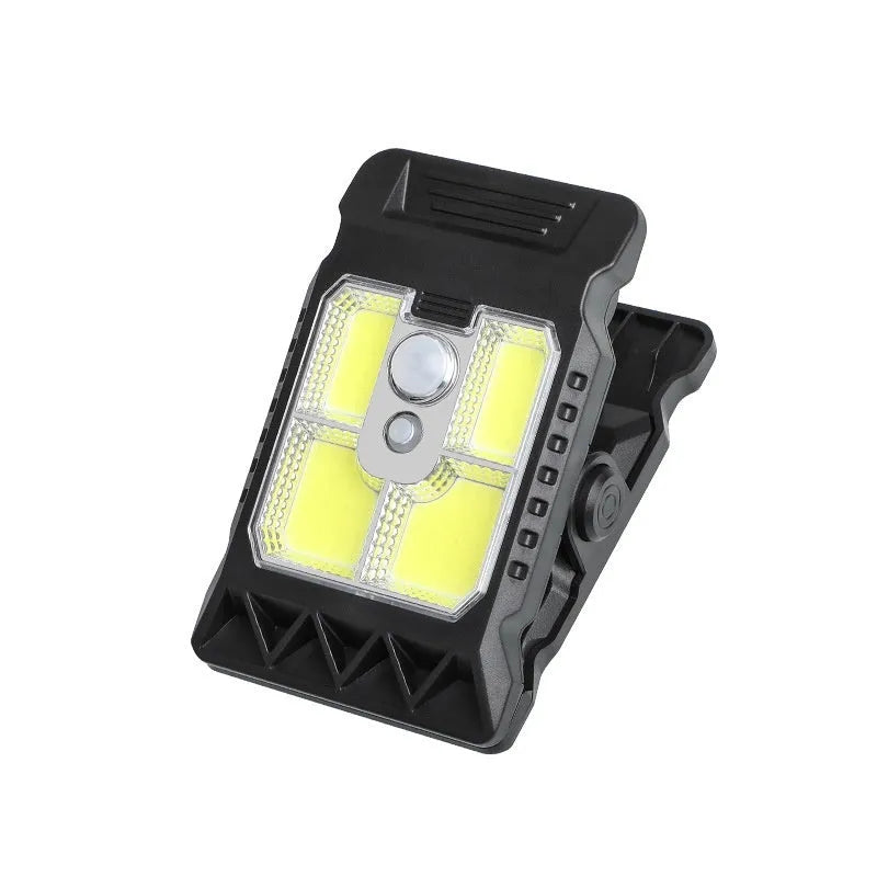 Black intelligent induction clip lamp with flexible gooseneck, shown clipped to a shelf.