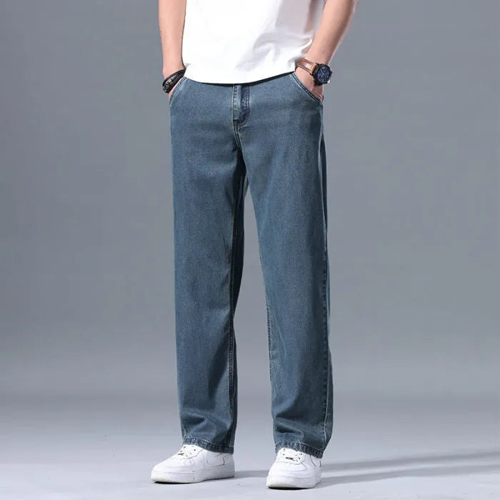 Men's loose straight leg lyocell jeans in light blue colour with zipper fly closure