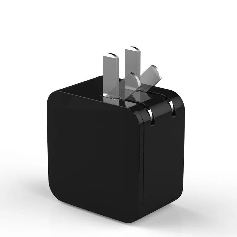 Black dual USB fast charger with digital display showing 5V output and UK plug