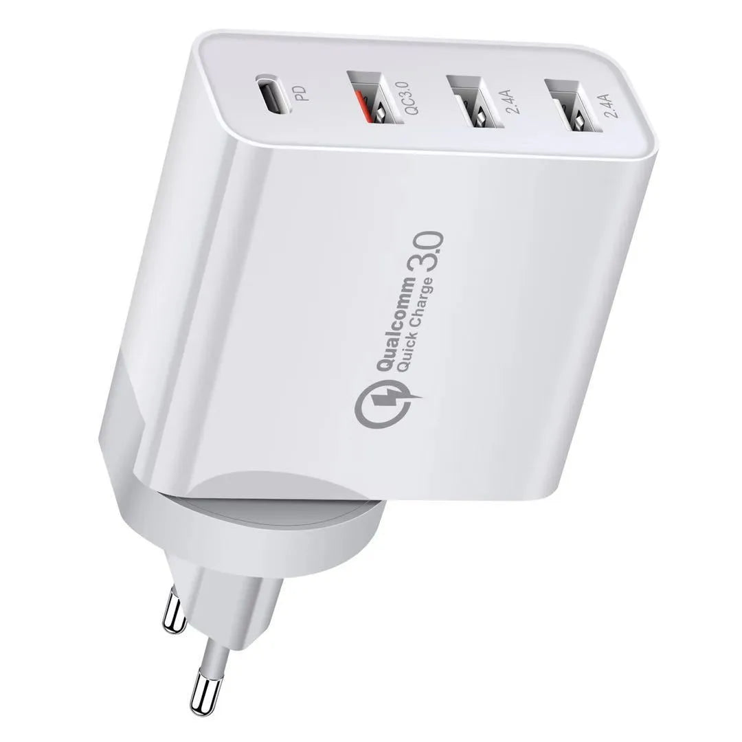 White multi-port fast charger with USB-C and USB-A ports plugged into a wall socket.