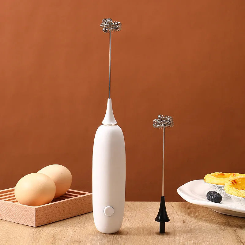 Handheld electric milk frother blender in black and white colours with frothing whisk