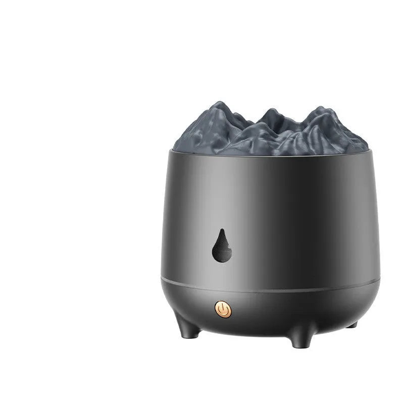 Black volcano-shaped ultrasonic humidifier and aroma diffuser with USB cable on a wooden table.