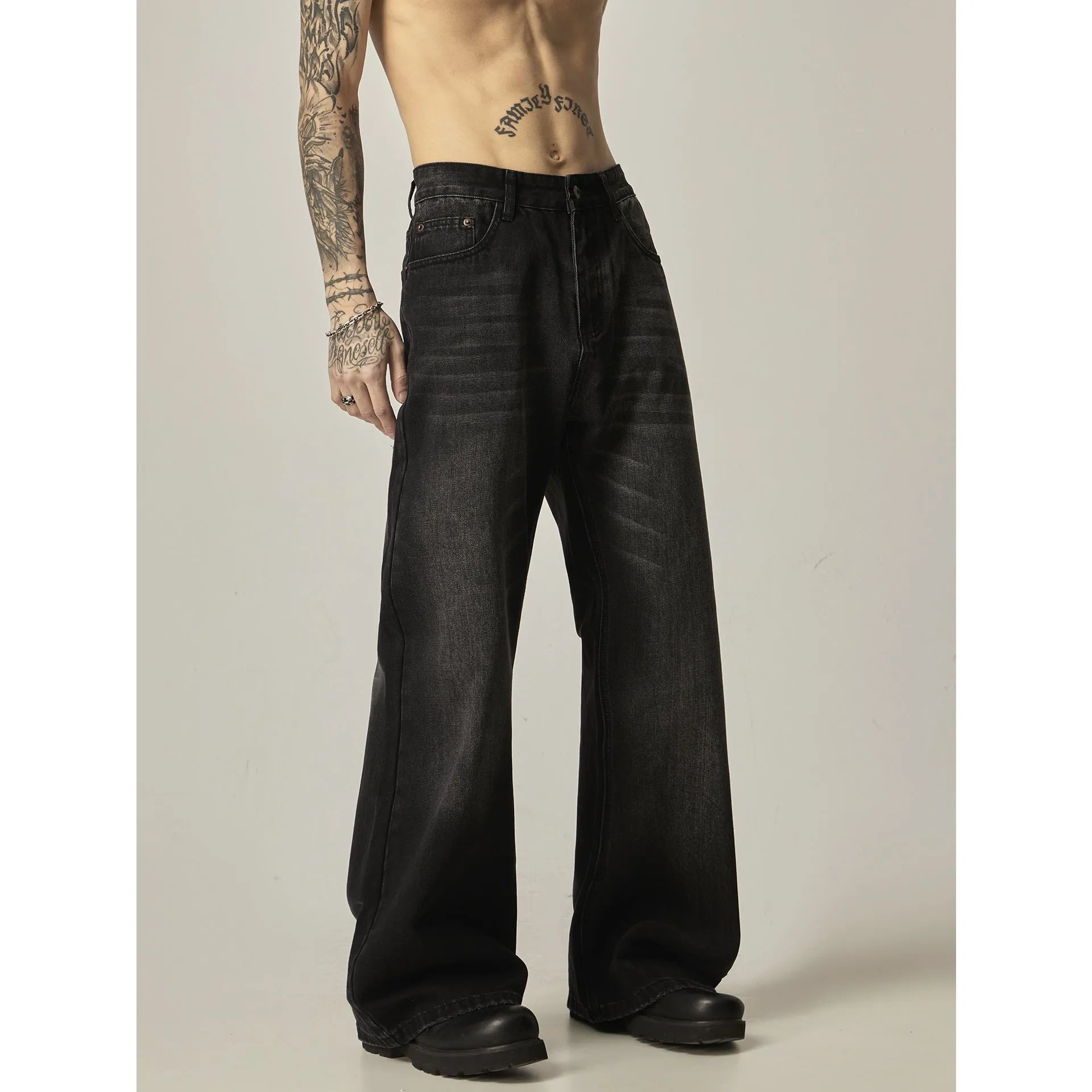 Black loose straight jeans with retro American styling and zipper fly opening