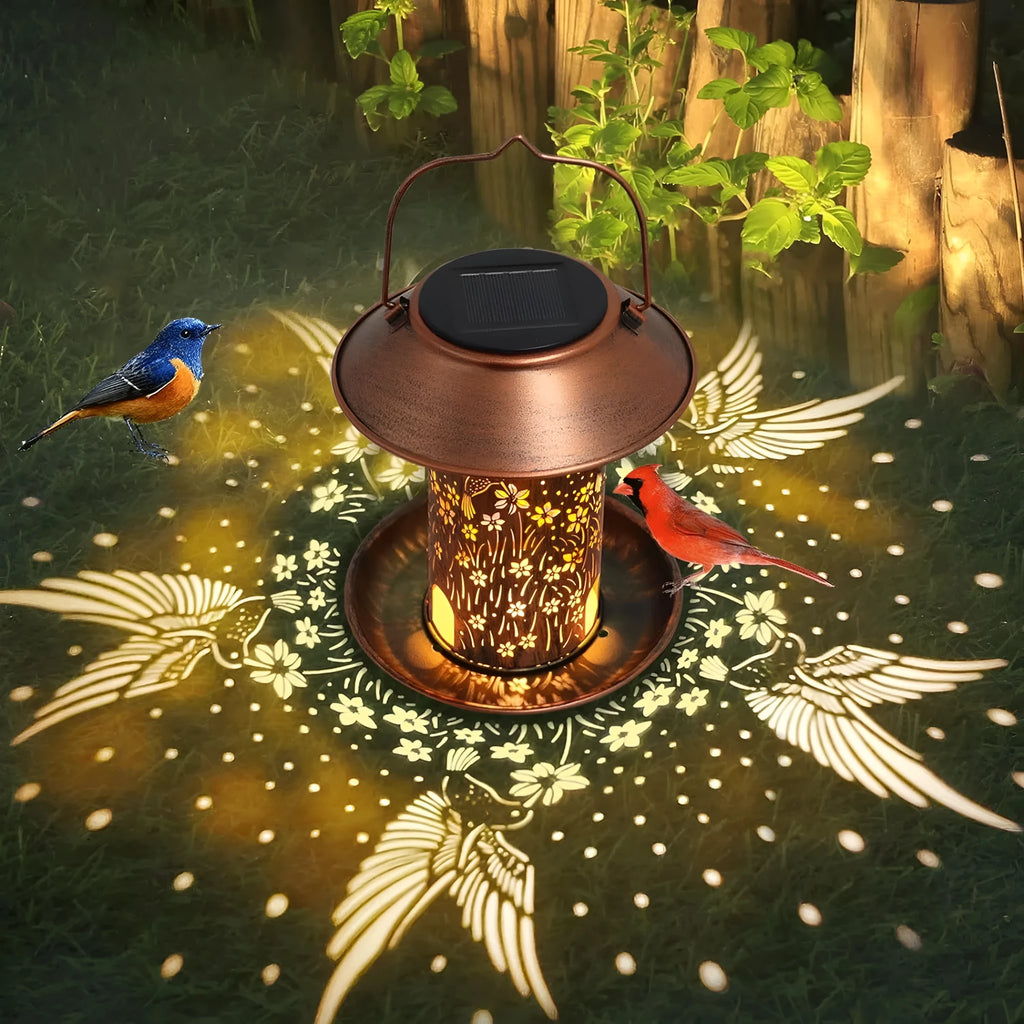 Solar-powered hummingbird pattern bird feeder with integrated garden lighting in iron art construction