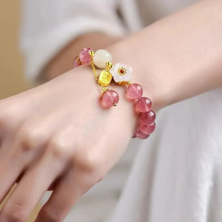 Handmade strawberry quartz crystal bracelet for women showing natural bead designs