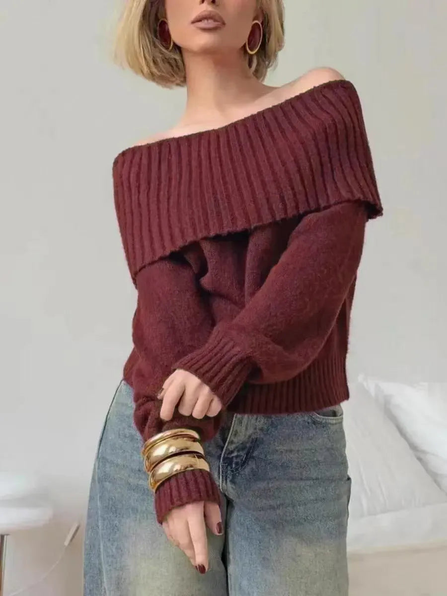 Grey strapless off-the-shoulder acrylic sweater with a 3D pattern, shown as a pullover.