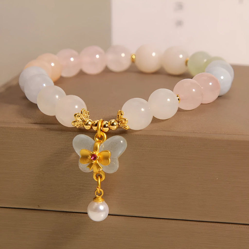 Women's crystal bead bracelet with a colourful natural Morganite stone butterfly pendant.