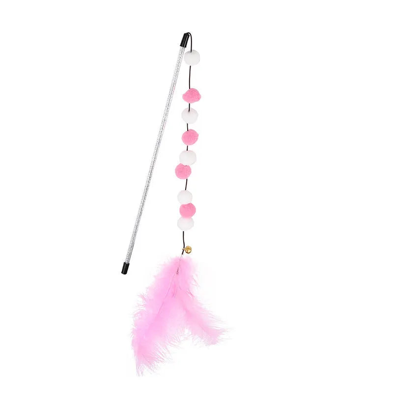 Colourful cat teaser toy rod with bell and pompon feather attachment on grey background