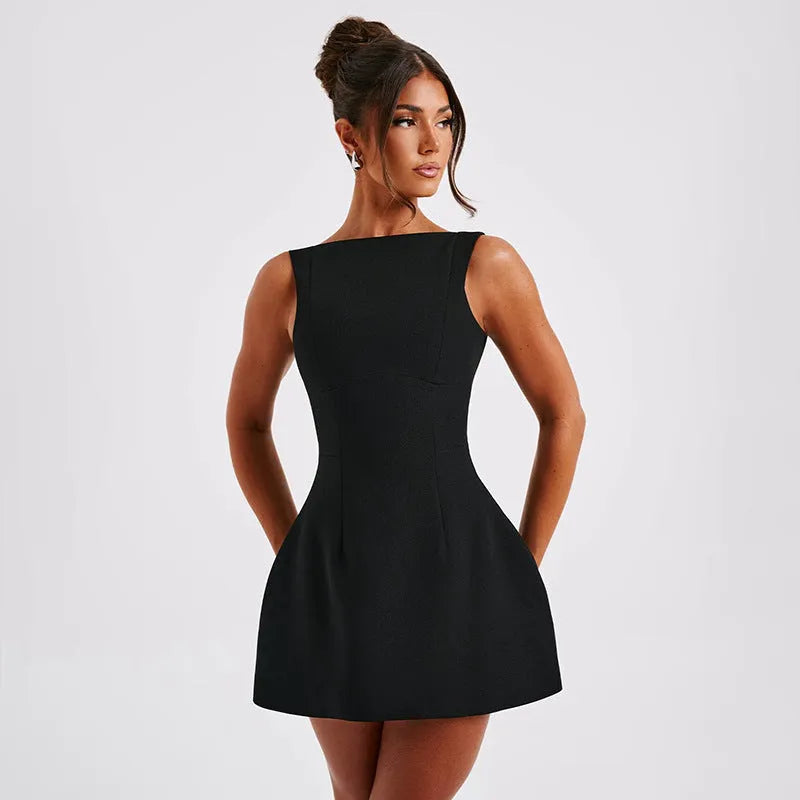 Slim-fitting backless sleeveless dress in polyester fabric, shown in a short length with a high waist.