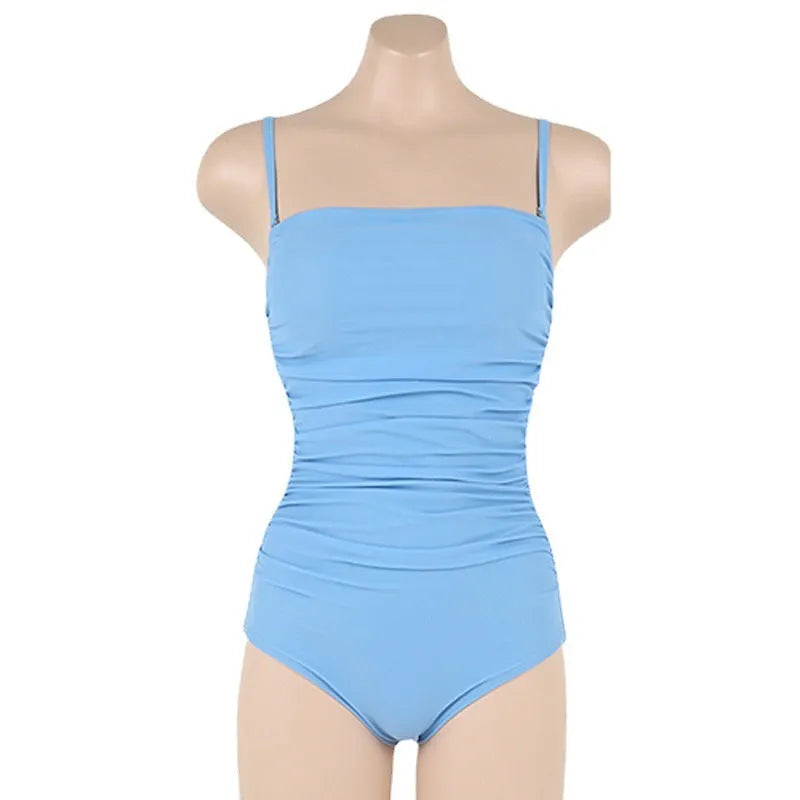 Women's sling style one-piece swimsuit with belly pleats in a solid colour.