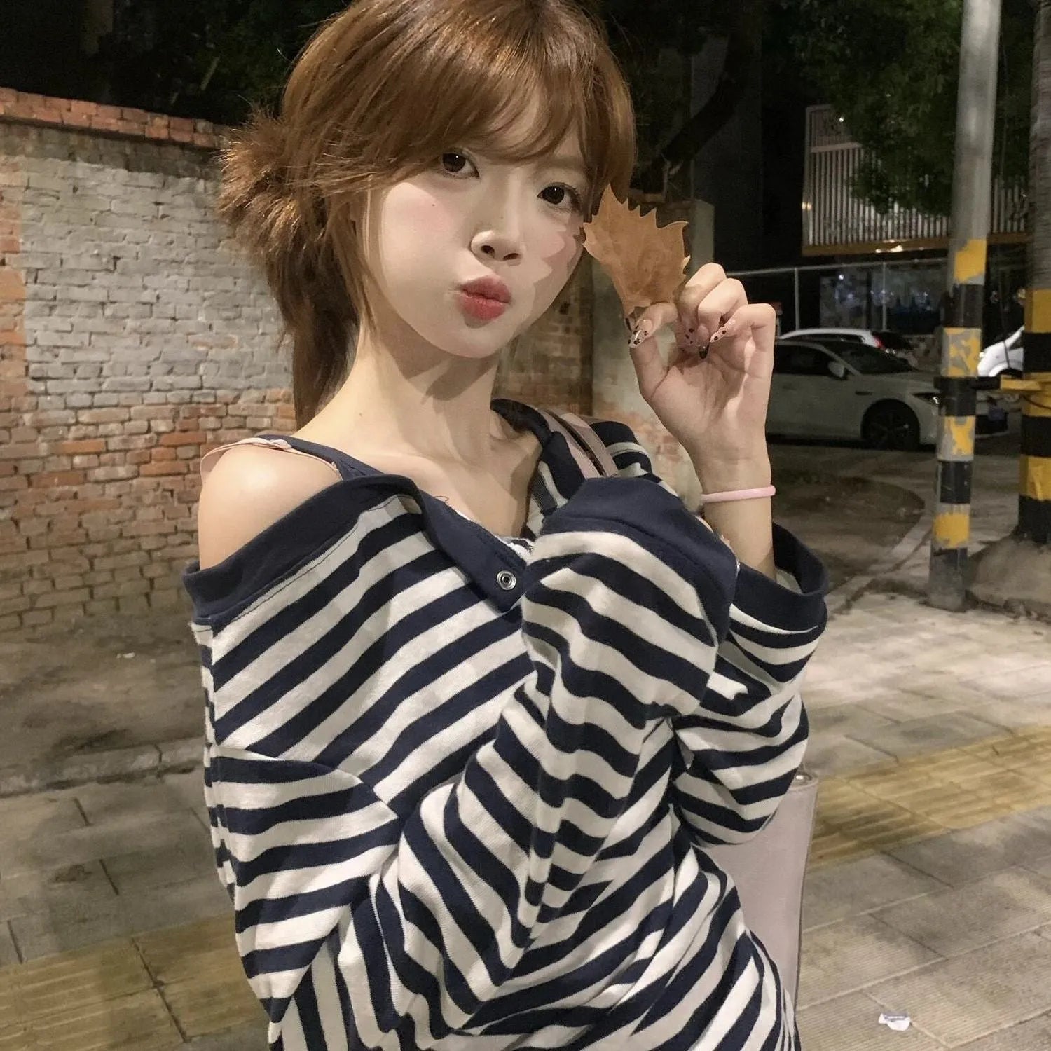 Dark blue oversized long-sleeved women's T-shirt with embroidery and stripe details on soft viscose fabric.