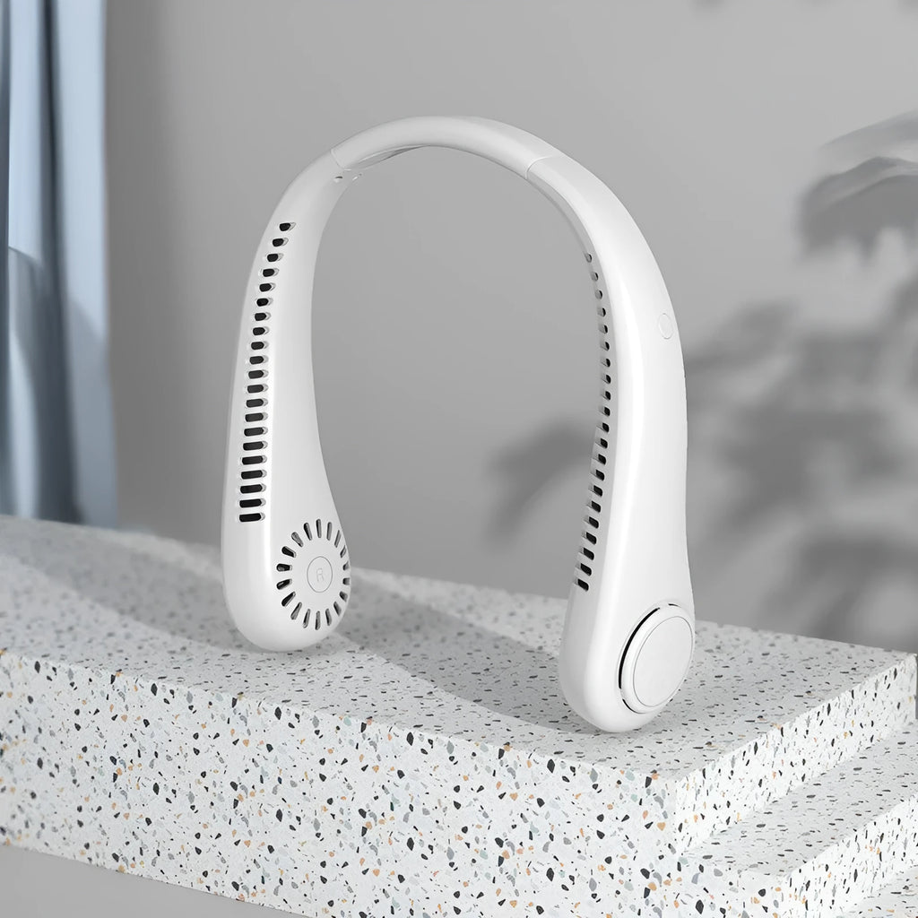 White bladeless neck fan being worn showing hands-free design and USB charging port