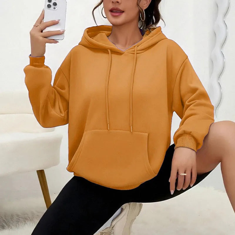 Women's loose grey sweatshirt with drawstring pockets and long sleeves