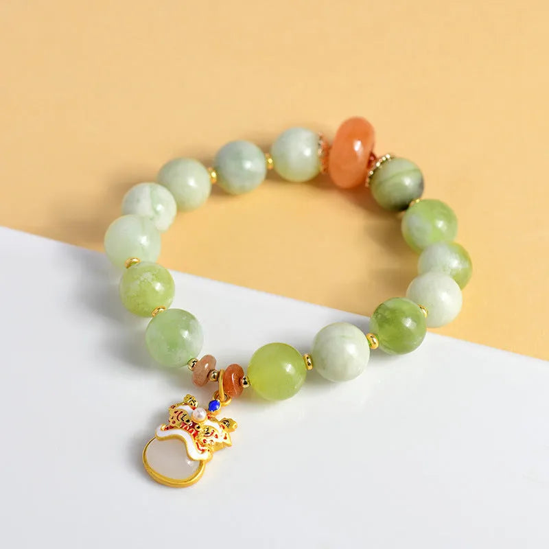 Green milk-in-water Xingshi jade pendant bracelet with 10mm geometric beads on elastic band