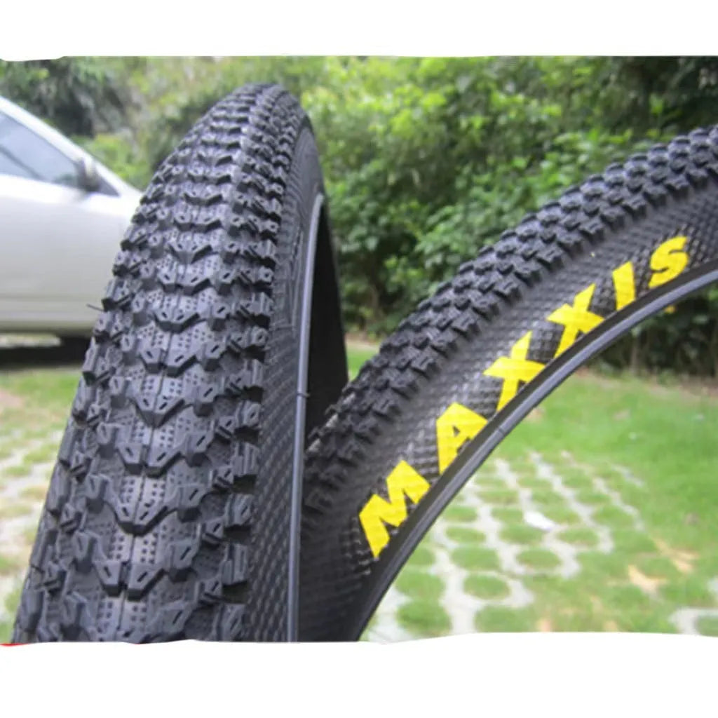 Ultralight puncture-proof mountain bike tyre shown in multiple sizes including 26, 27.5 and 29-inch options.