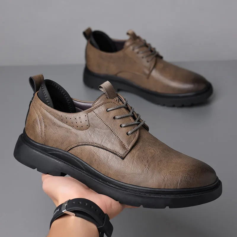 Men's black and brown leather sneaker with sewing line detail on a two-layer cowhide upper and rubber sole.