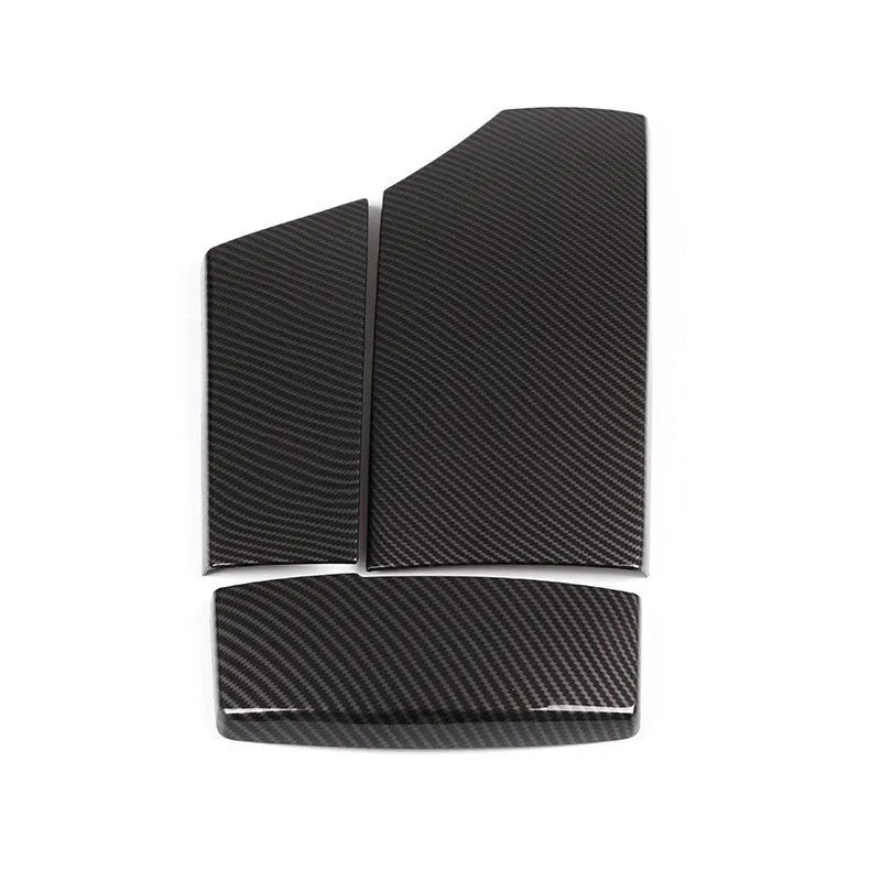 Set of three black ABS plastic armrest box covers with a shiny diagonal carbon fibre weave pattern.