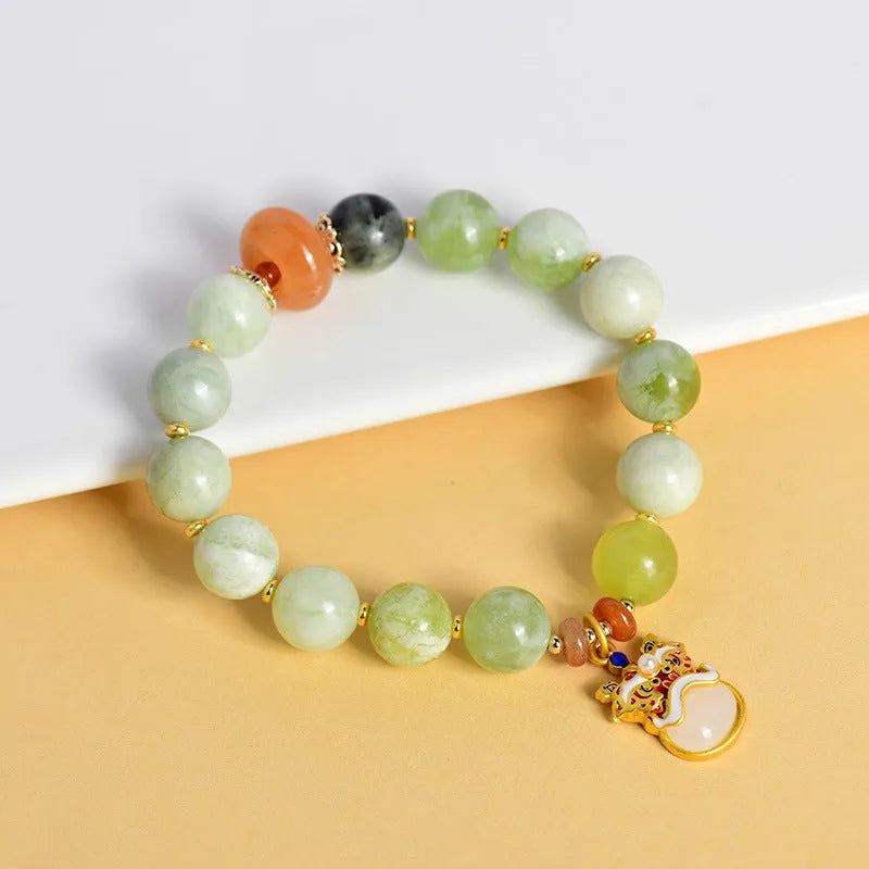 Green milk-in-water Xingshi jade pendant bracelet with 10mm geometric beads on elastic band