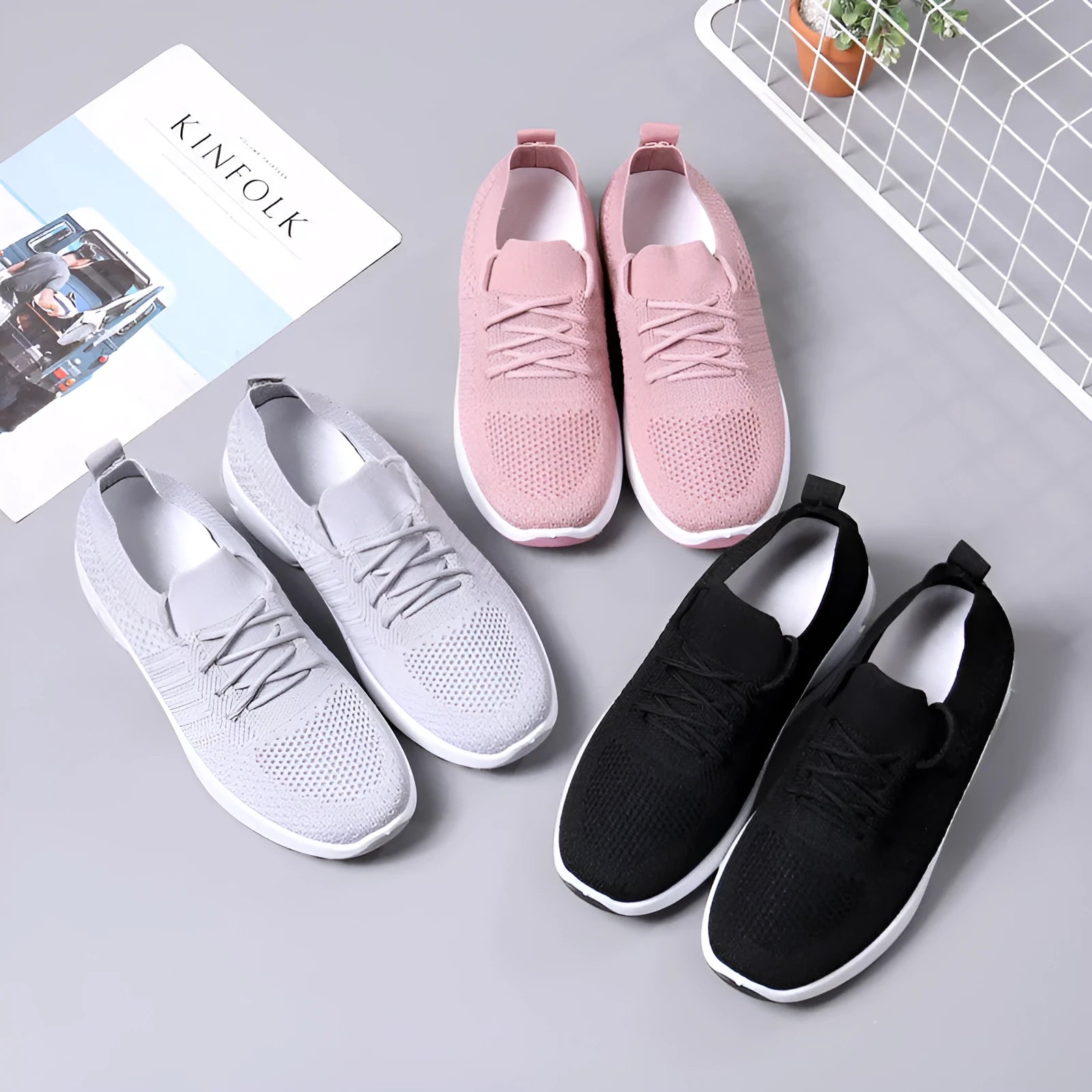 Women's black mesh casual sneakers with round toe and white non-slip PVC sole on a light background.