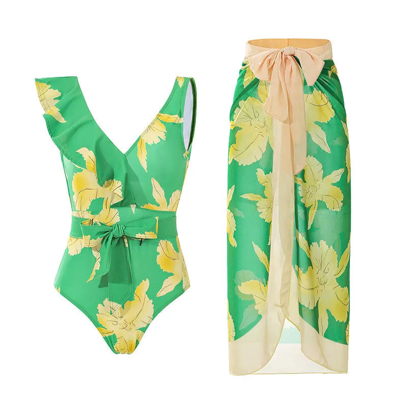 Women's solid colour one-piece swimsuit with spaghetti straps and a matching detachable skirt.