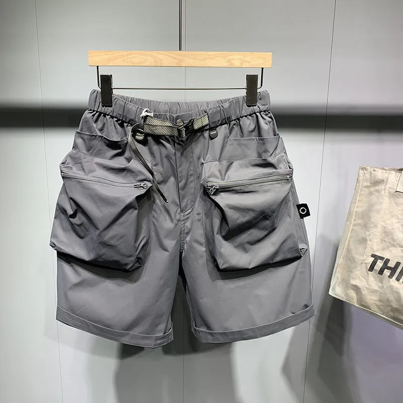Men's black work shorts with multiple pockets and above-knee length