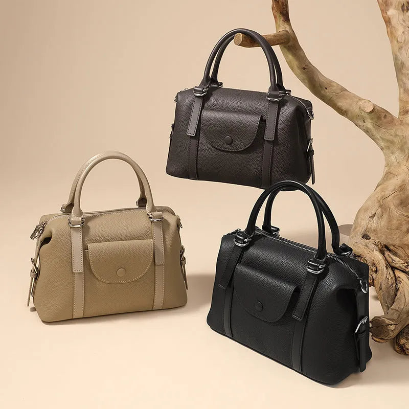 Women's genuine leather handbag in street-trend style with lock closure and contrast stitching
