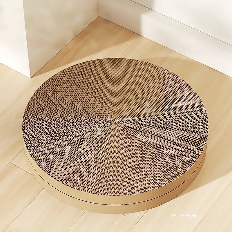Round green cat scratching board with corrugated paper insert measuring 55cm diameter with two replacement refills