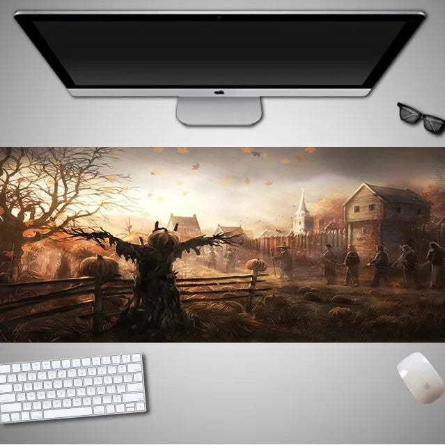Oversized rectangular Halloween-themed mouse pad on a desk, showing non-slip rubber cloth base.