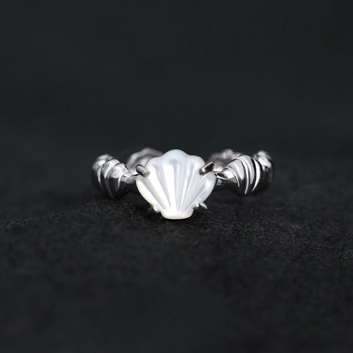 Women's adjustable silver ring with natural shell and tiger eye stone in cold-style design