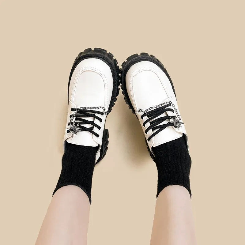 Women's Duke Asterism colour loafers with a cross strap and metal buckle on a round toe.