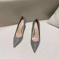 Women's wedding shoes in PU leather with crystal details, available in black and silver colours with different heel heights