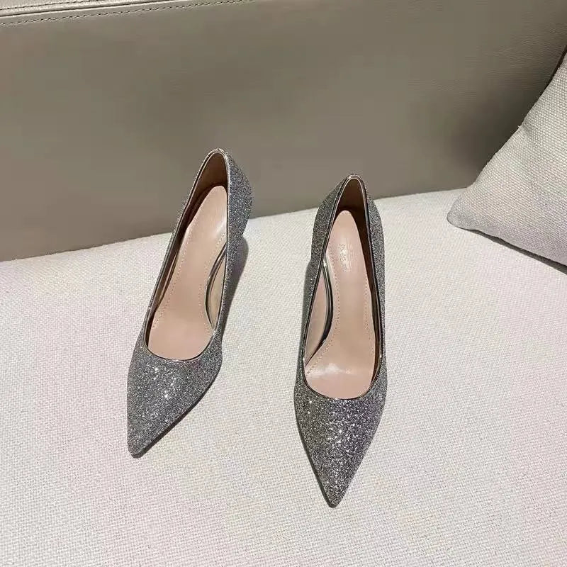 Women's wedding shoes in PU leather with crystal details, available in black and silver colours with different heel heights