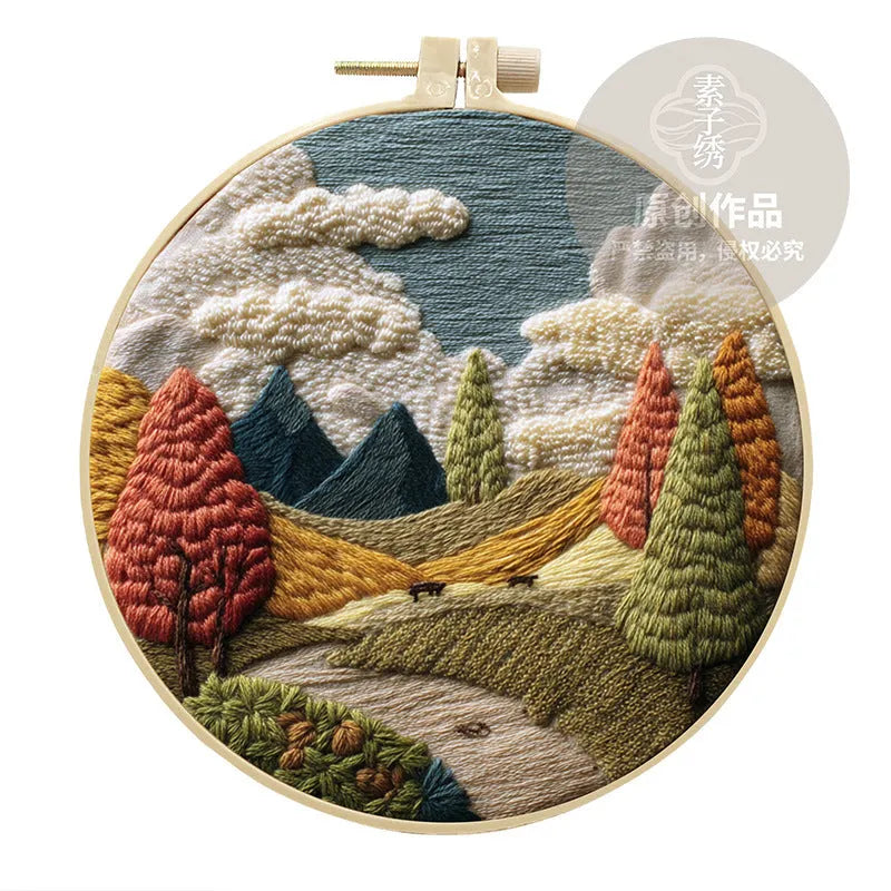 Embroidery DIY landscape kit with cotton fabric, bamboo frame, scissors, and thread for scenic designs