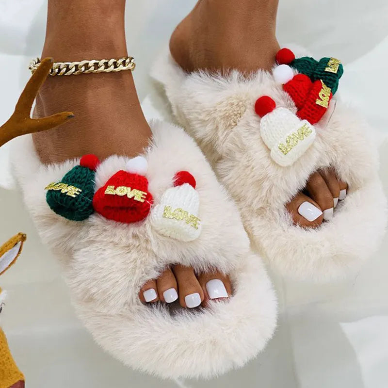 Women's Christmas hat decorated hairy faux plush slippers with rubber sole.