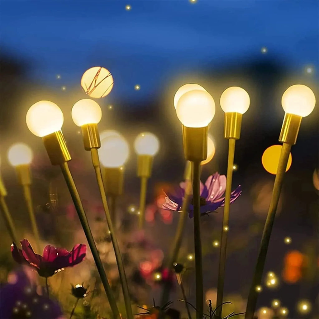 Solar-powered LED firefly ground lights with stainless steel stake for garden installation