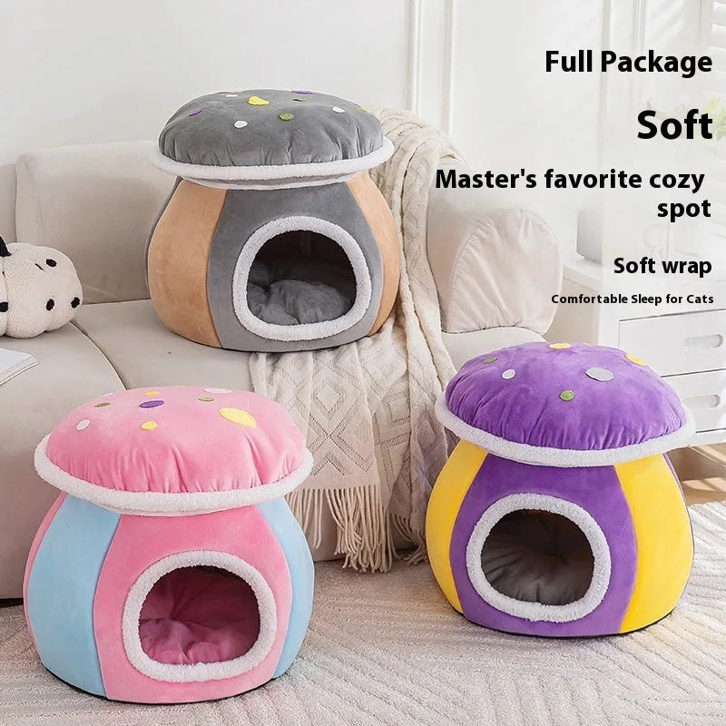 Purple mushroom-shaped plush cat nest with a detachable blanket, shown on a wooden floor.