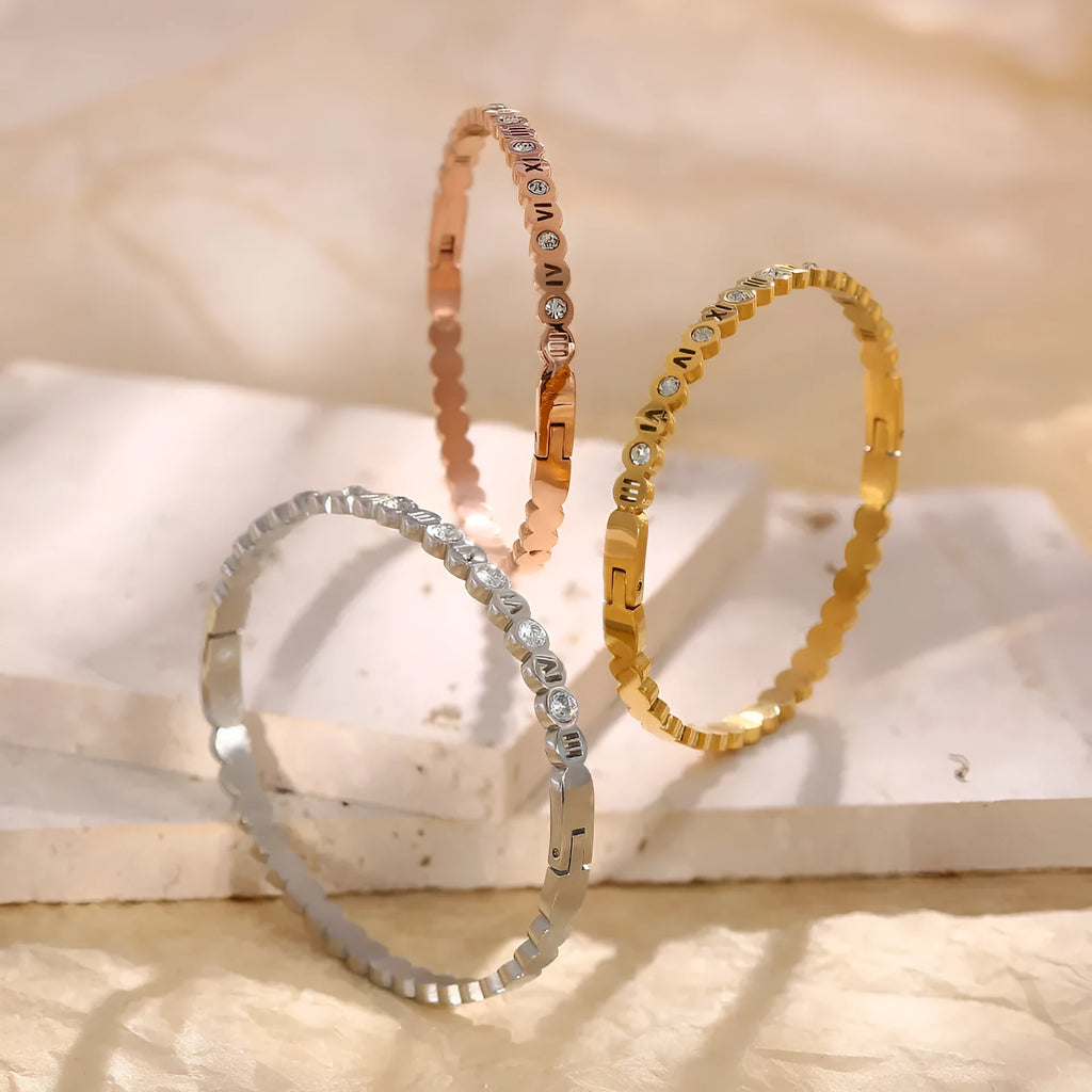 Korean style titanium steel bracelet in gold, rose gold or steel colour with number design details.