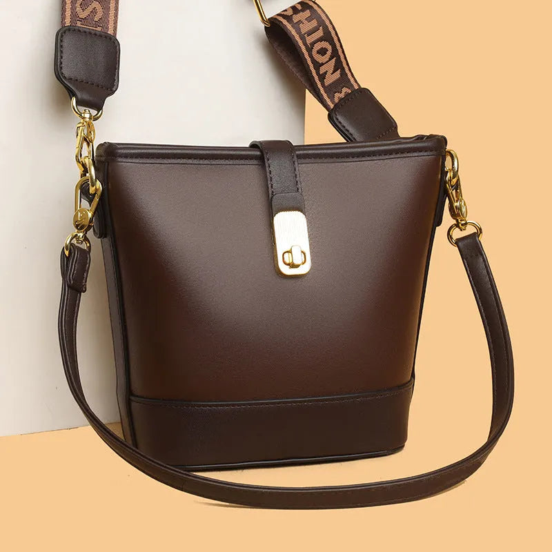 Korean style black bucket bag with dual shoulder straps and multiple internal zippered compartments