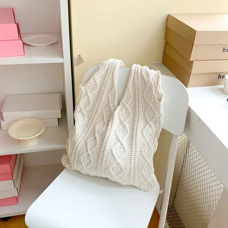 Women's retro style hollow knitted polyester tote bag in a solid colour, showing large open top and textured yarn material.