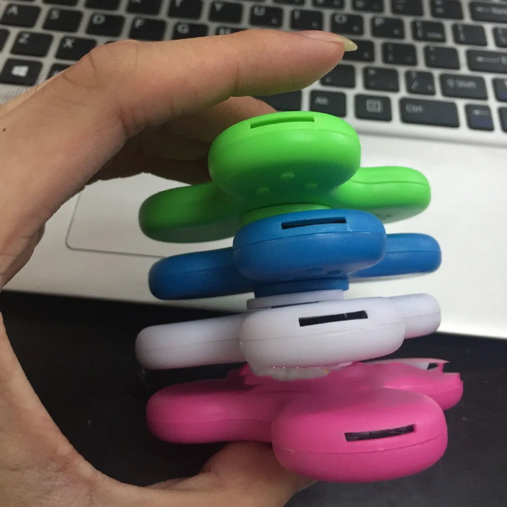 Bluetooth speaker music fidget spinner EDC toy in white, showing portable ABS build